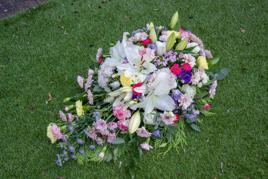 Funeral Floral Spray Tribute on Green Grass Lawn