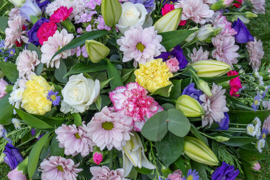 Colorful Funeral Casket Spray Flower Arrangement Close Up