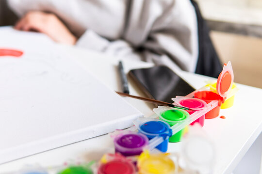 Colorful paint palette and brush for home art project