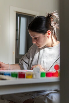 Woman create art with paint at home