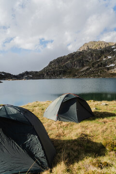 Tents By Pyrenees Mountain Lake