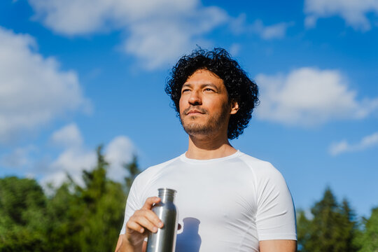 Runner Standing In Meadow