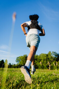 Sprinting Across Grassy Meadow