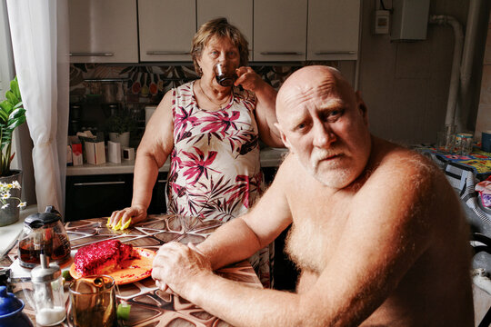 Couple eating Russian salad "under a fur coat" 