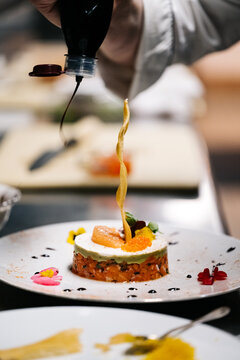 Chef dressing a plate