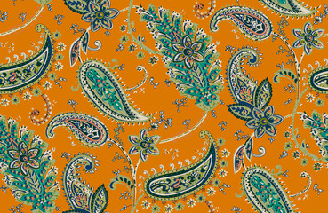 Seamless repeating pattern with paisley motifs placed at different angles, balanced by smaller floral elements and filler © Venkatsai