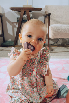 baby playing with baby teether