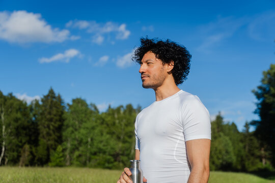 Athlete Holding Water Bottle