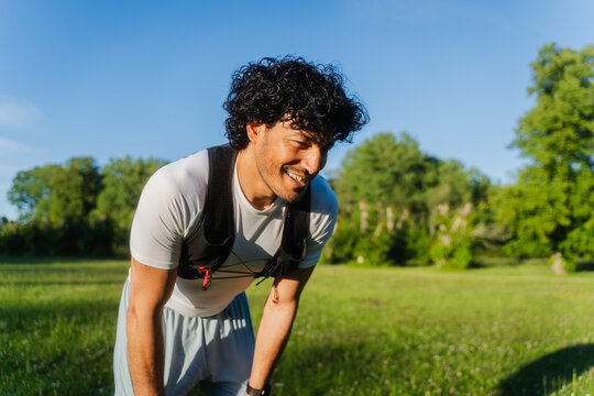 Smiling Athlete Resting On Grass