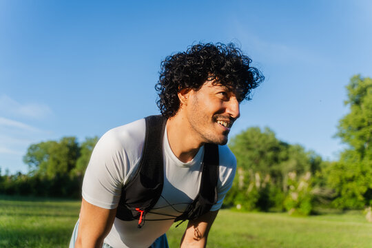 Happy Runner Pausing Outdoors
