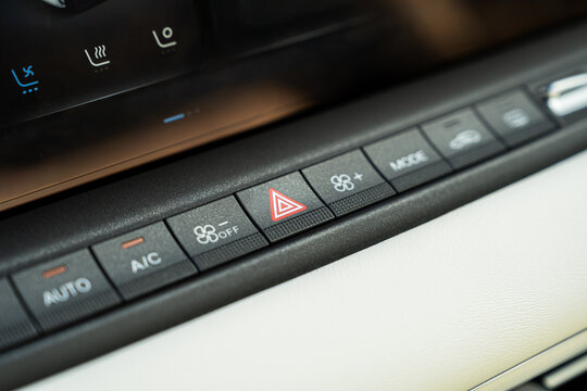 Electric car climate control panel with hazard warning button