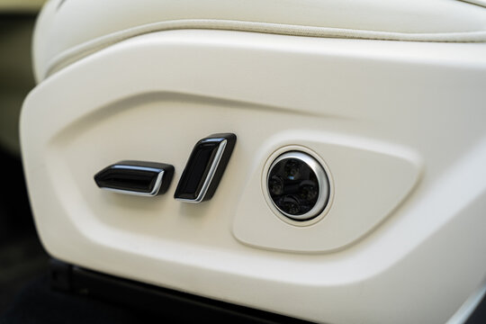 Electric car seat adjustment control detail in luxury interior