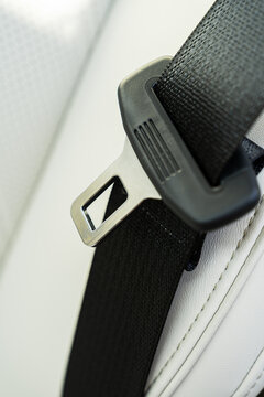 Seat belt tongue detail in modern electric car interior