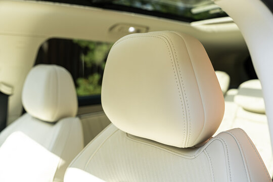 Electric car interior with white leather front seats