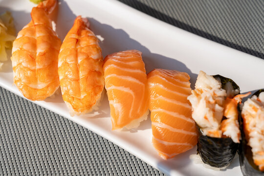 Close-up of salmon sushi rolls with rice and seaweed