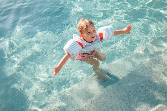 Child Wearing Pool Floaties
