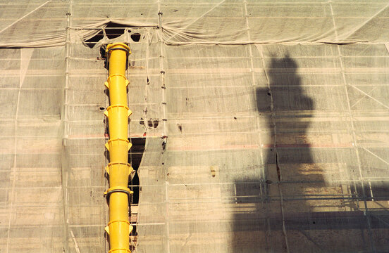 Yellow Chute on Wrapped Building