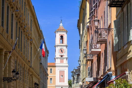 Historic street and clock tower in old Nice, France