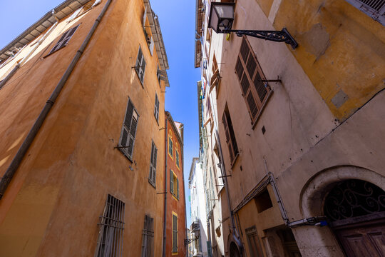 Narrow historic street in Nice old town, France