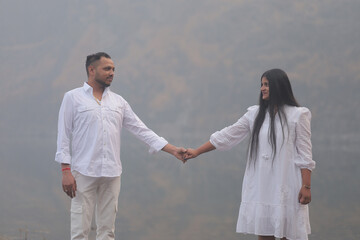 Romantic Indian couple sharing an intimate moment while embracing in a beautifully decorated...