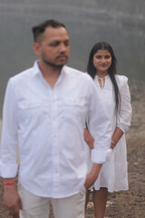 Romantic Indian couple sharing an intimate moment while embracing in a beautifully decorated...
