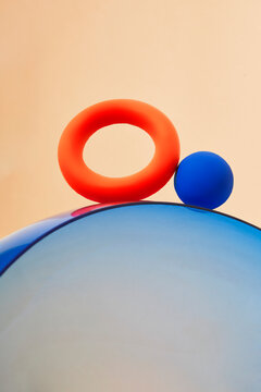 Minimal geometric composition with red ring and blue sphere