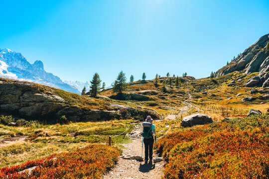 Solo Female Hiker Standing on Mountain Ridge Looking at Mont Blanc Massif in Chamonix French Alps