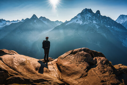 Successful Solo Hiker on Mountain Ridge and Mont Blanc Massif on Sunny Day at Chamonix France