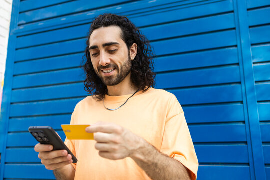 Man use smartphone and credit card for online payment