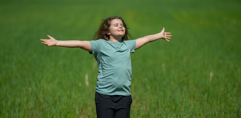 Fototapeta premium Kid open arms support healthy childhood. Kid open arms celebrate playful nature. Happy kid open arms create smiles. Summer kid open arms feel carefree.