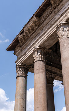 Ancient Roman temple columns and ornate stone architecture