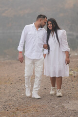 Romantic Indian couple sharing an intimate moment while embracing in a beautifully decorated...