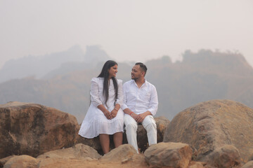 Romantic Indian couple sharing an intimate moment while embracing in a beautifully decorated...