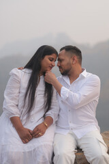 Romantic Indian couple sharing an intimate moment while embracing in a beautifully decorated...