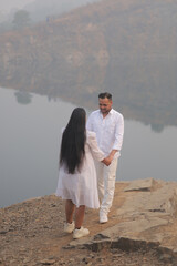 Romantic Indian couple sharing an intimate moment while embracing in a beautifully decorated...