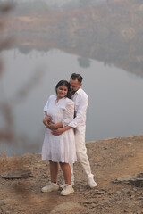 Romantic Indian couple sharing an intimate moment while embracing in a beautifully decorated...