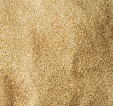Natural fine beige sand texture background with macro photography background close-up material abstract particulate