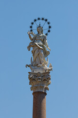 Naklejka premium Lucca - The marble statue of Immaculate Conception -Colonna della Madonna dello Stellario, on the square Piazza Santa Maria Forisportam by Giovanni Lazzoni (1687)