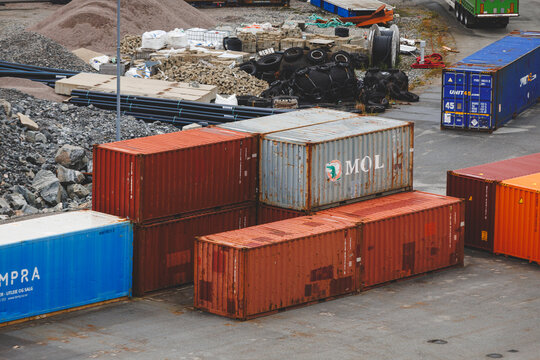 Alesund, Norway, August 17, 2026. Weathered MOL and other freight containers