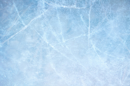 Light blue frozen ice texture with subtle cracks background backdrop abstract structure copy-space template