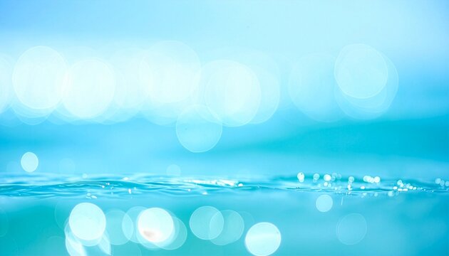 Blue ocean water surface with bokeh circles background, summer sea and nature abstract concept