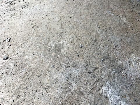 Rough Concrete Surface With Small Pebbles And Cracks Texture Background