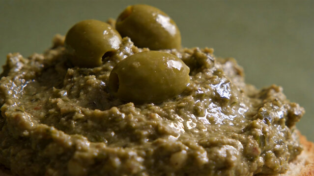 Close-up of olive spread with green olives