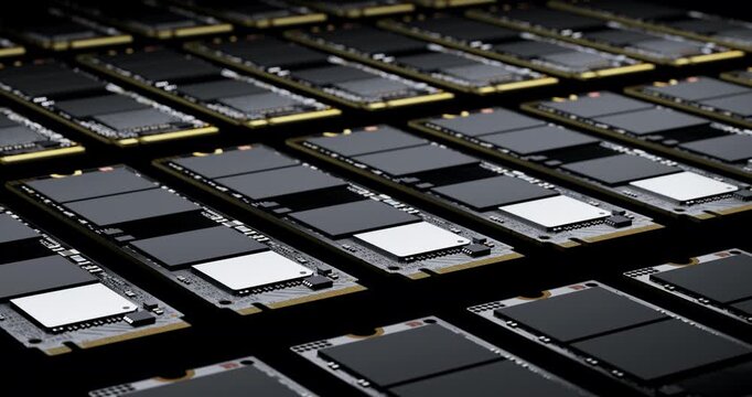 Endless rows of solid state drives moving forward on production line in dark space showing hardware supply chain concept