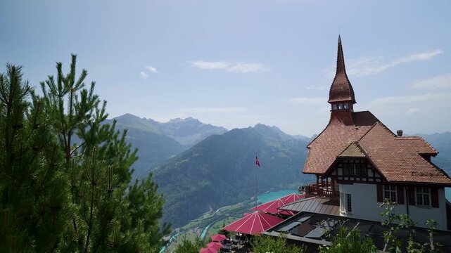 Stunning panoramic view of the restaurant on harder kulm mountain overlooking lake thun and the alps. Switzerland