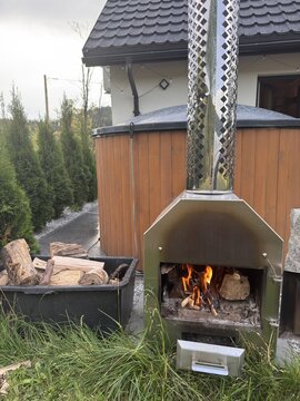 Wood burning stove heats outdoor tub