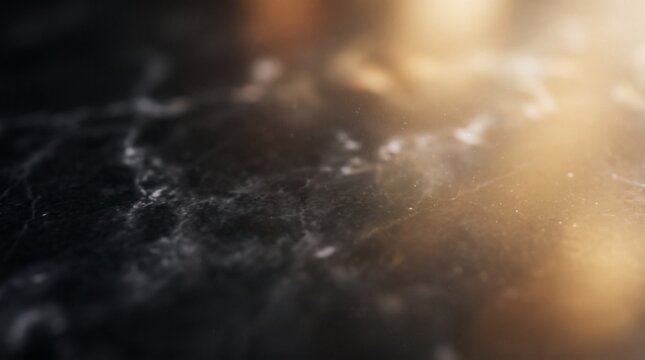 Abstract background featuring soft golden light leaks and blurred particles floating in dark moody space