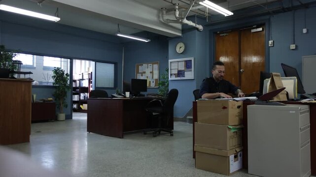 Police team in bullpen working on cases at the station - crime investigation