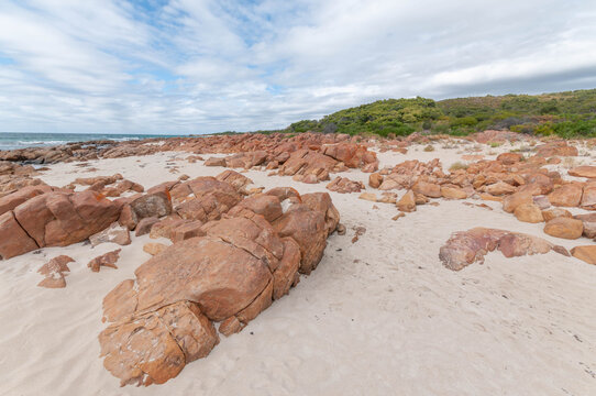 Rocky beach with red granite on the Western Australian coast