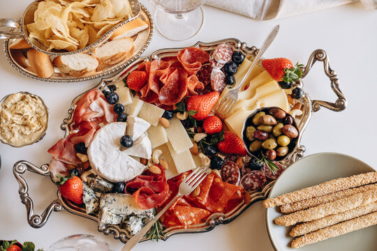 Elegant Charcuterie Board With Cheese, Cured Meats, Olives and Fresh Strawberries for Entertaining